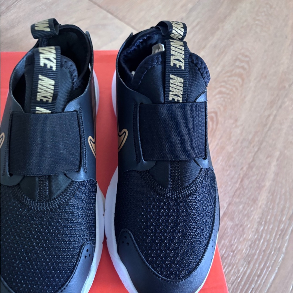 Nike Kids Black and Gold Slip-On Sneakers
